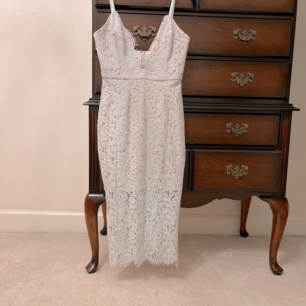 A stunning lace dress made by house of CB